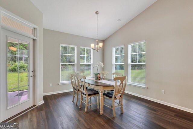 128 Clearwater Dr, Brunswick, GA 31523 - dining area featuring a wealth of natural light, baseboards, an inviting chandelier, and dark wood finished floors