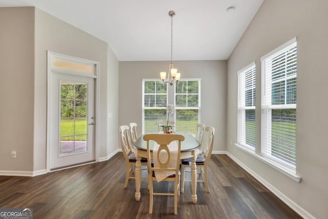 128 Clearwater Dr, Brunswick, GA 31523 - dining space with a wealth of natural light, baseboards, dark wood-style flooring, and an inviting chandelier