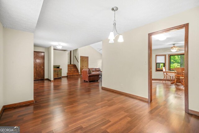 unfurnished dining area featuring baseboards and wood finished floors
