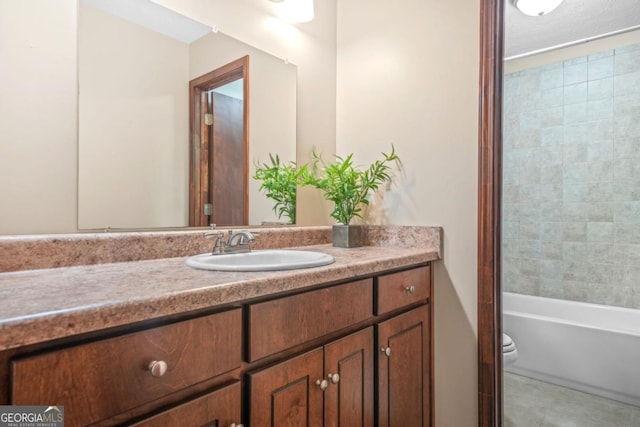 full bathroom featuring vanity, tile patterned flooring, and toilet