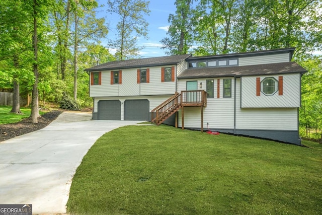 bi-level home with an attached garage, driveway, a front lawn, and stairway