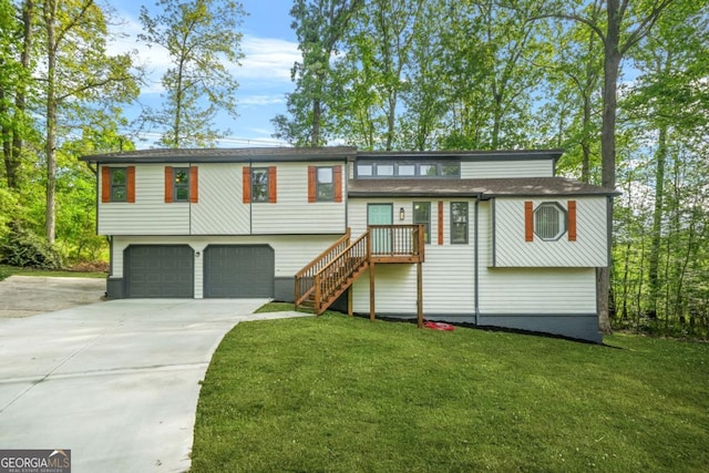 view of front facade featuring an attached garage, a front lawn, driveway, and stairway