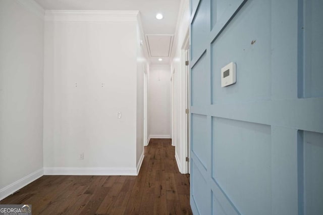 hall with attic access, dark wood finished floors, baseboards, and recessed lighting