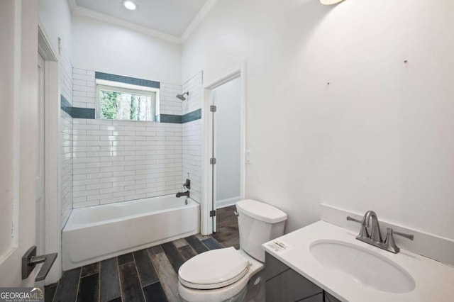 full bathroom with wood finished floors, toilet, vanity, tub / shower combination, and crown molding