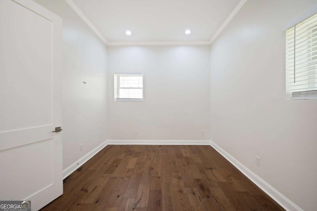 empty room with recessed lighting, wood finished floors, crown molding, and baseboards