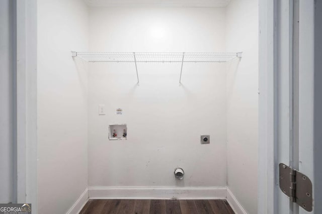 washroom featuring electric dryer hookup, dark wood-type flooring, laundry area, and washer hookup
