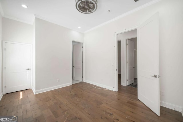 unfurnished bedroom featuring recessed lighting, wood finished floors, baseboards, and ornamental molding