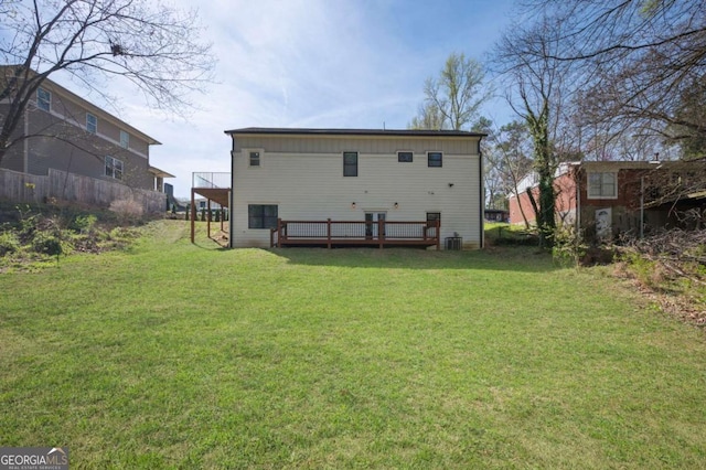 back of house with a yard, central AC unit, and a deck