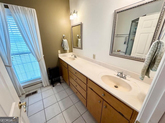357 Douglas Hwy, Ocilla, GA 31774 - bathroom with tile patterned floors, a sink, visible vents, and double vanity