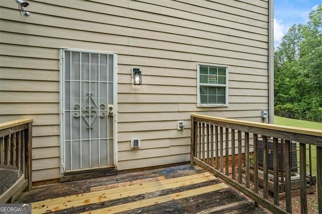 view of exterior entry featuring a deck
