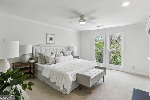 bedroom with light carpet, visible vents, and ornamental molding