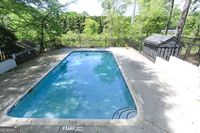 view of pool featuring a fenced in pool and fence