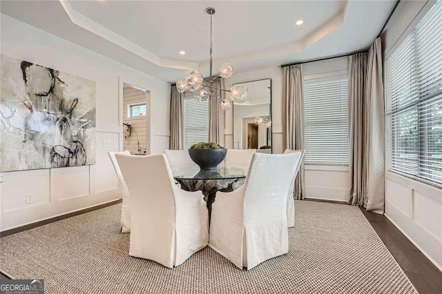 1059 Antioch Dr, Brookhaven, GA 30319 - dining space with an inviting chandelier, a decorative wall, a tray ceiling, and a wealth of natural light