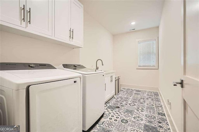 1059 Antioch Dr, Brookhaven, GA 30319 - laundry room with visible vents, baseboards, washing machine and clothes dryer, a sink, and cabinet space