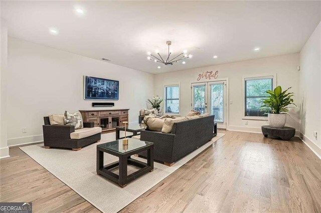 1059 Antioch Dr, Brookhaven, GA 30319 - living room featuring light wood-type flooring, recessed lighting, baseboards, and a chandelier