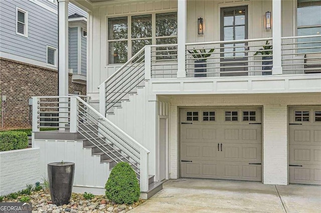 1059 Antioch Dr, Brookhaven, GA 30319 - property entrance featuring concrete driveway, board and batten siding, covered porch, and a garage
