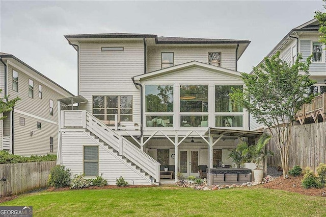 1059 Antioch Dr, Brookhaven, GA 30319 - rear view of house with french doors, fence, and a lawn