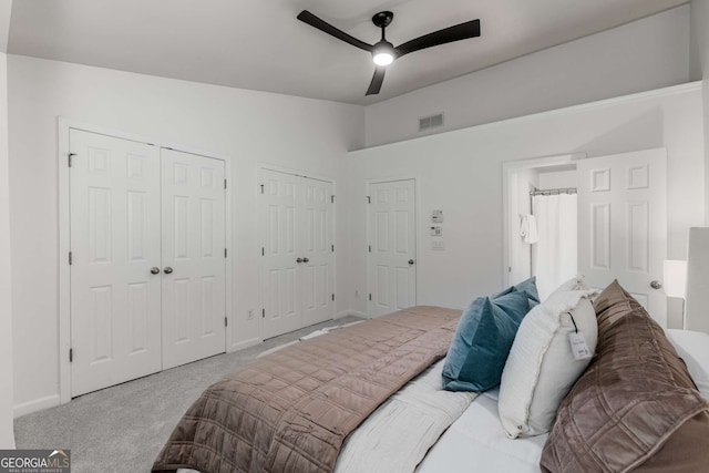 863 Commonwealth Ave SE, Atlanta, GA 30312 - carpeted bedroom with multiple closets, vaulted ceiling, baseboards, and ceiling fan