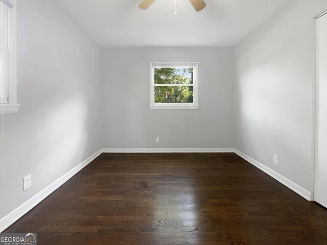 233 Banberry Dr SE, Atlanta, GA 30315 - unfurnished room featuring baseboards, a ceiling fan, and dark wood-type flooring
