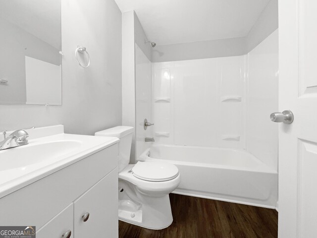 233 Banberry Dr SE, Atlanta, GA 30315 - bathroom with wood finished floors, vanity,  shower combination, and toilet