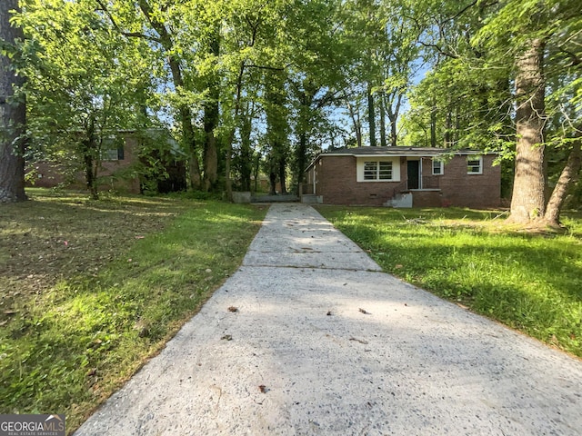 233 Banberry Dr SE, Atlanta, GA 30315 - ranch-style home featuring brick siding, driveway, and a front yard