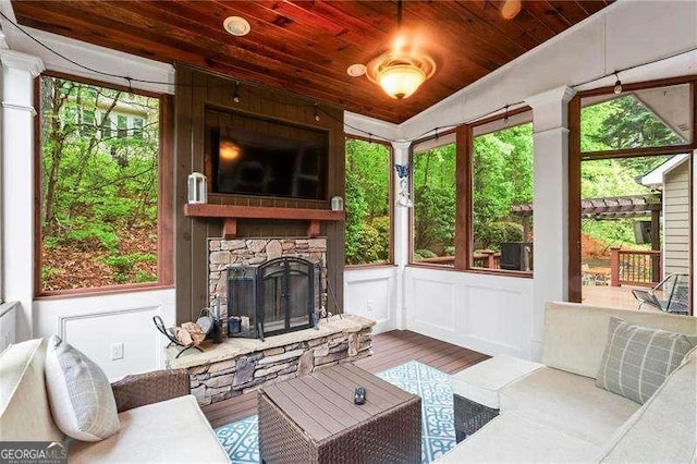 5729 Brookstone Walk NW, Acworth, GA 30101 - living room featuring wooden ceiling, a fireplace, healthy amount of natural light, and a decorative wall