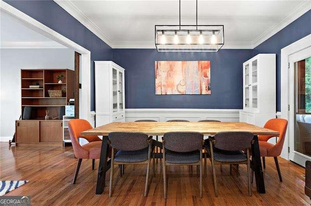 5729 Brookstone Walk NW, Acworth, GA 30101 - dining space featuring crown molding, wood finished floors, and wainscoting