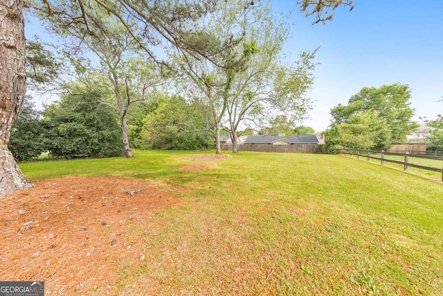 view of yard featuring fence