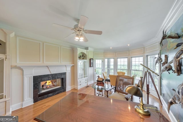 988 Hunters Rdg, Jasper, GA 30143 - living area featuring a ceiling fan, ornamental molding, light wood finished floors, and a high end fireplace