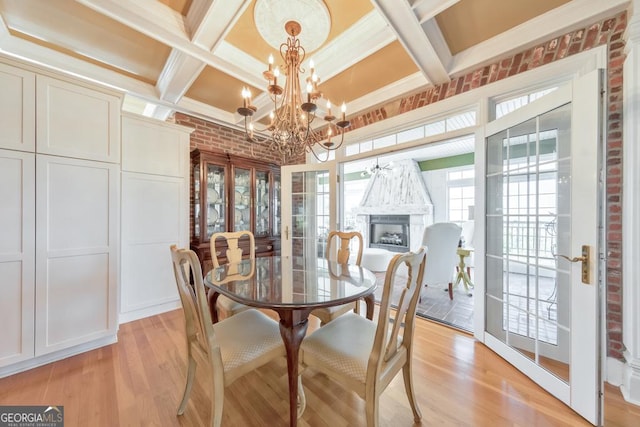 988 Hunters Rdg, Jasper, GA 30143 - dining area with a notable chandelier, light wood-style flooring, and coffered ceiling