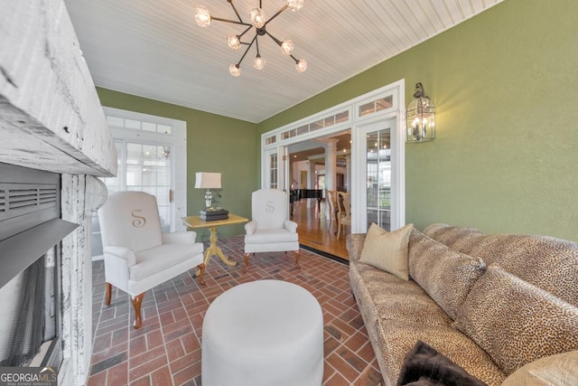 988 Hunters Rdg, Jasper, GA 30143 - living room with brick floor and a chandelier