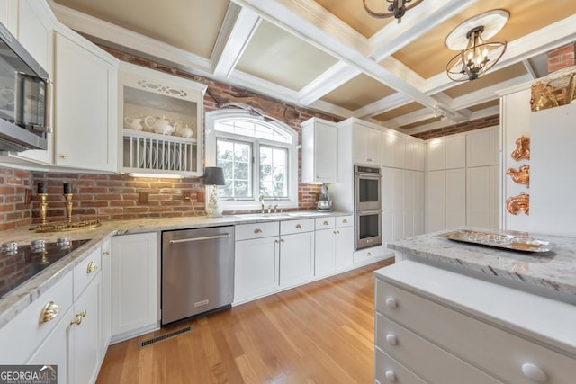988 Hunters Rdg, Jasper, GA 30143 - kitchen with stainless steel appliances, white cabinetry, and light wood-style floors