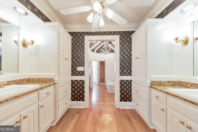 988 Hunters Rdg, Jasper, GA 30143 - full bath with ornamental molding, two vanities, ceiling fan, and wood finished floors