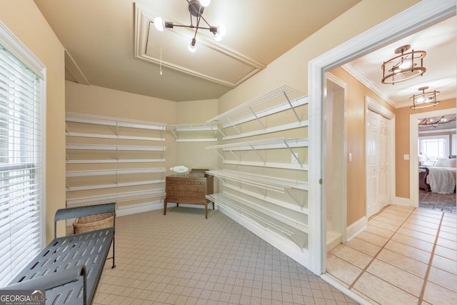 988 Hunters Rdg, Jasper, GA 30143 - interior space featuring carpet flooring, an inviting chandelier, and attic access