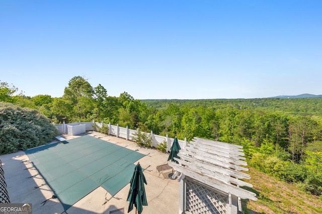 988 Hunters Rdg, Jasper, GA 30143 - view of swimming pool with a forest view, fence, a patio area, and a fenced in pool