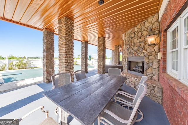 988 Hunters Rdg, Jasper, GA 30143 - view of patio / terrace featuring an outdoor stone fireplace and fence
