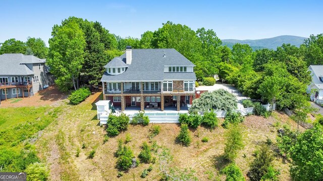 988 Hunters Rdg, Jasper, GA 30143 - rear view of house featuring a chimney, a fenced backyard, and a deck