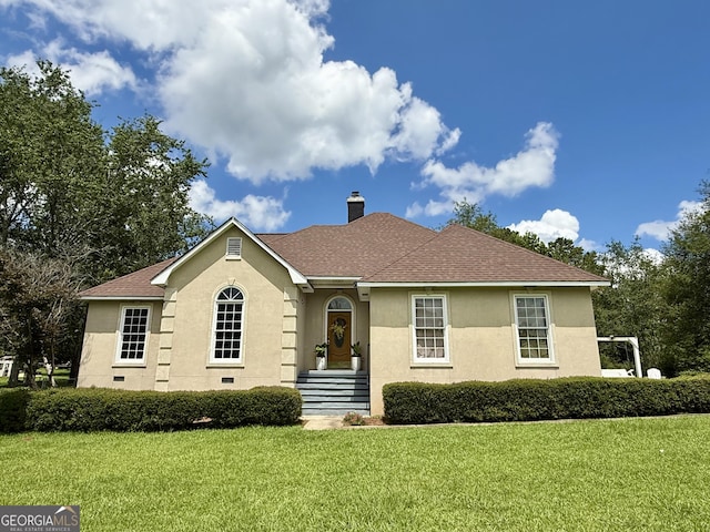 1087 Forsyth Landing Dr, Forsyth, GA 31029 - view of front facade with a front lawn, a chimney, and stucco siding