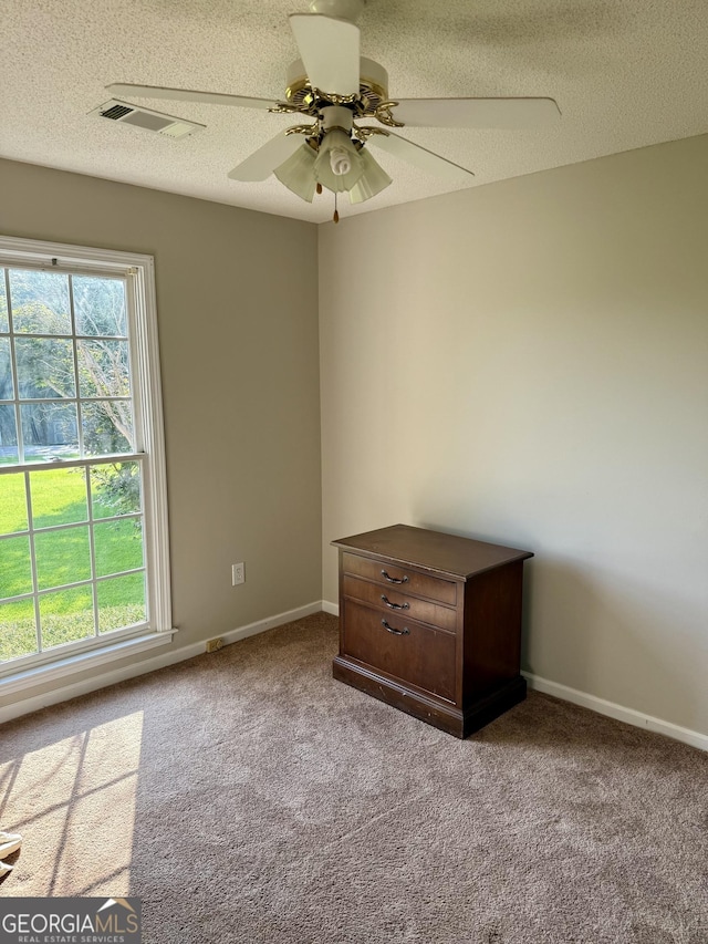 1087 Forsyth Landing Dr, Forsyth, GA 31029 - unfurnished room with carpet flooring, ceiling fan, and a textured ceiling