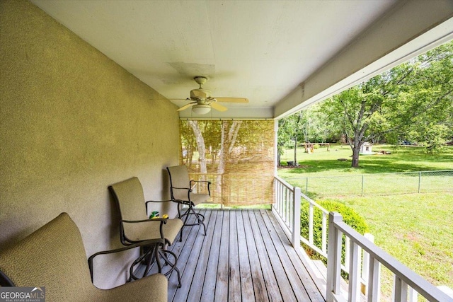 1087 Forsyth Landing Dr, Forsyth, GA 31029 - porch featuring ceiling fan and a yard