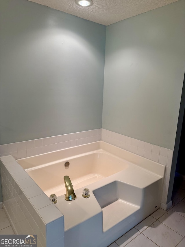 1087 Forsyth Landing Dr, Forsyth, GA 31029 - full bathroom with a garden tub and a textured ceiling