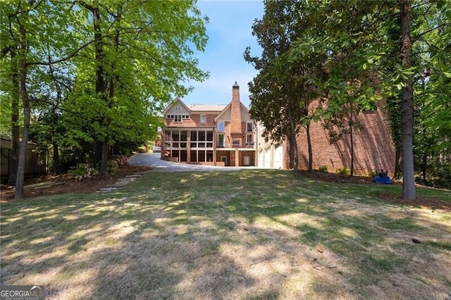 4835 Merlendale Ct, Atlanta, GA 30327 - view of yard featuring an attached garage