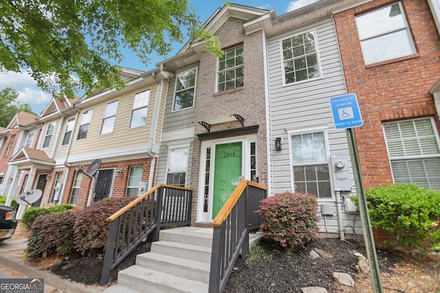 multi unit property featuring brick siding