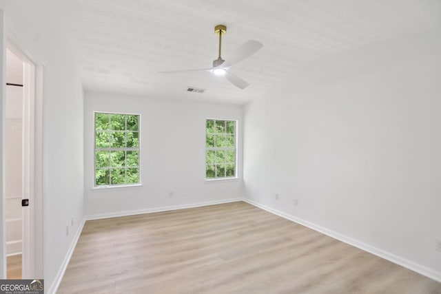 full bath featuring toilet, shower / bathing tub combination, visible vents, wood finished floors, and vanity