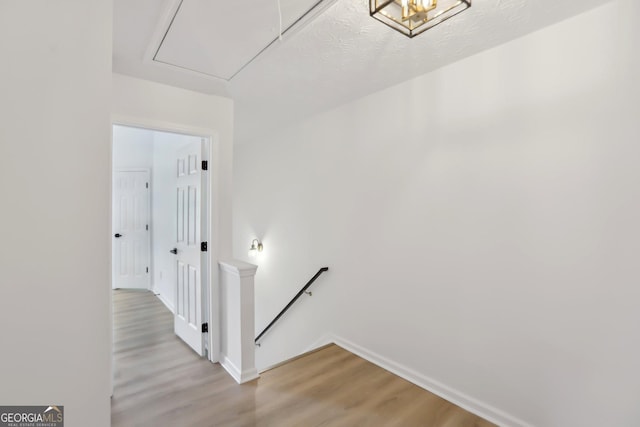 unfurnished bedroom with lofted ceiling, light wood finished floors, baseboards, and ceiling fan