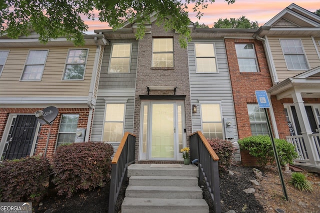 rear view of property with cooling unit, a patio, and fence