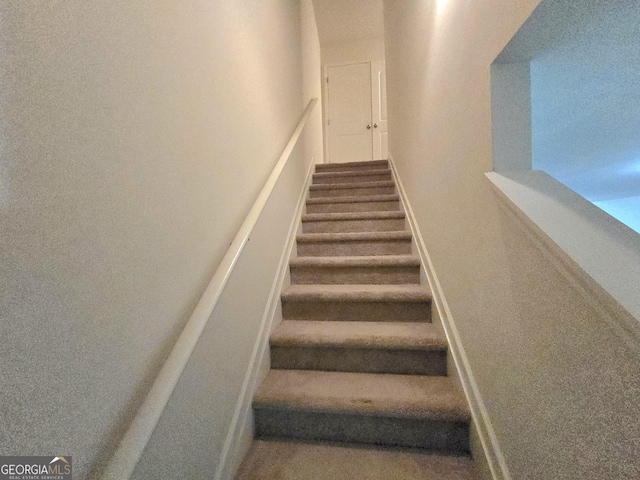 staircase with baseboards