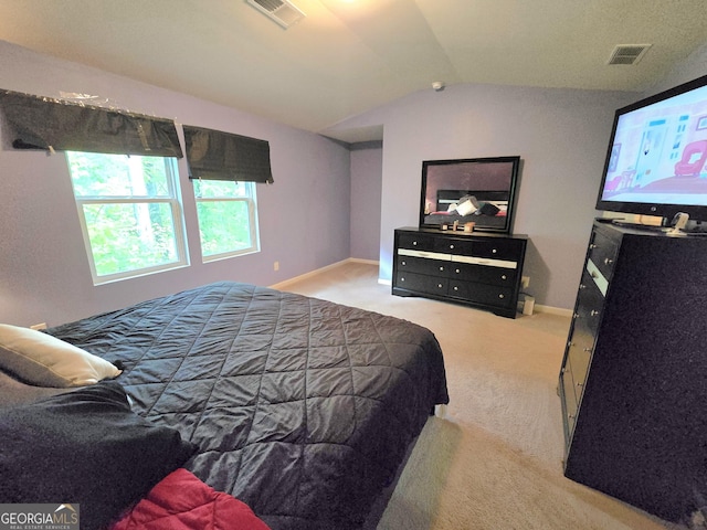 carpeted bedroom with lofted ceiling and baseboards