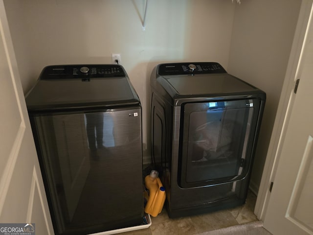 laundry area with separate washer and dryer