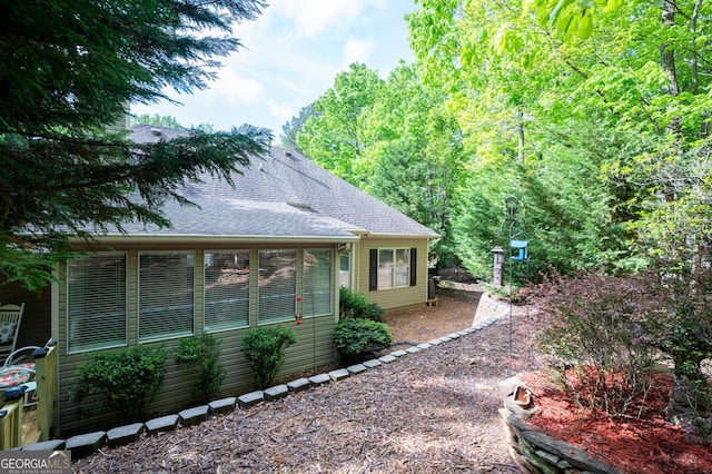 view of home's exterior featuring a shingled roof
